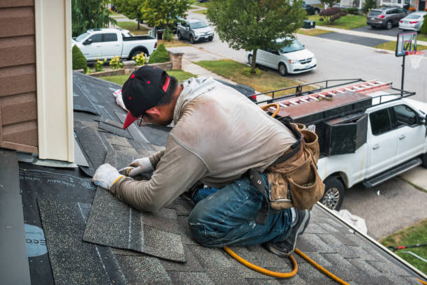 Professional Roof Replacement technician working in Bloomington, CA